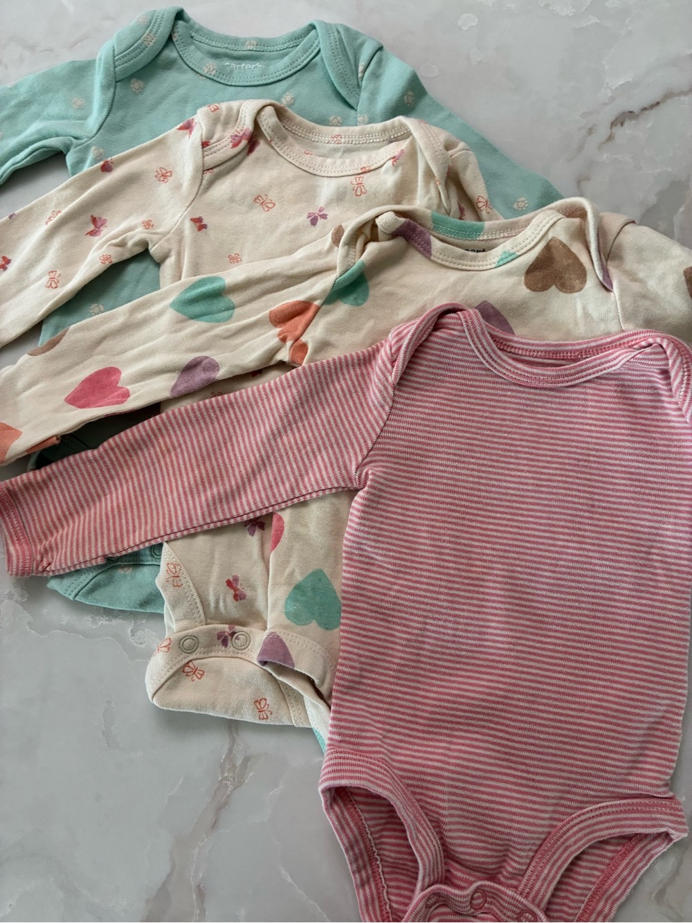 Set of 4 Carter’s bodysuits